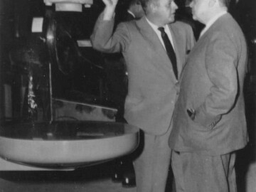 With one of the Theratron Jr., Co-60, teletherapy units manufactured at Commercial Products Division in Ottawa. Photo source - AECL 0021L1000