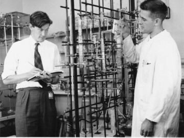 Dr. P.J. Dyne investing the effects of radiation on organic compounds (Dr. Dyne and W.J. Fletcher). Photo source - AECL 0026L1000