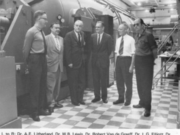 In front of EN Tandem accelerator with the inventor/designer of the Tandem series – R. Van de Graaff. Photo source - AECL 0039U1000
