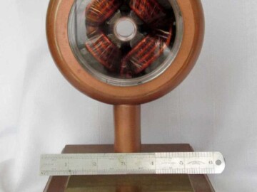 An Alvarez drift-tube. One of the drift-tubes from the Alvarez accelerator that was salvaged when the accelerator was dismantled in 1987. The cut-away section shows the quadrupole magnet used to keep the proton beam focussed. This unit was used as a retirement gift and donated to the Society.<br /><br />Photo source – the Society. 105-1000