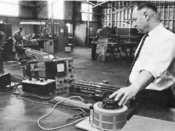 D. Bozvey conducts vibration tests on CANDU fuel bundles at the Power Projects lab.
<br /><br />
Photo source – AECL Review, September 1964. 106-1000