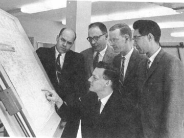 L-R. A. Dahlinger, G.L. Brooks, S.H. Russell, and G.A. Pon, Manager of the division.
<br /><br />
Photo source - AECL 108-1000