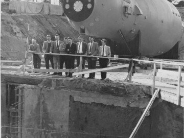 Arrival of the 13 MV “Emperor” or MP tandem – another world first, at CRNL in 1965. From L-R, E. Almqvist, G.C. Hanna, A.E. Litherland, C. Broude, J.A. Kuehner, J.D. Pearson and N. Burn. The EN tandem which it replaced was moved to McMaster University. J.A. Kuehner left CRNL to head the accelerator-based, nuclear-studies program at McMaster. Photo source - AECL 108-1000