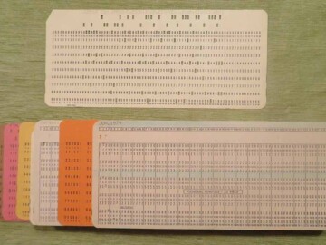 Punch cards. A new form of computer input arrived with the G-20 - paper punch cards that could be read rapidly by a reader. These 8.4 cm by 18.6 cm cards were used both to input programs and data. The input for a single run might consist of several thousand of these cards and the greatest fear for all who handled them was dropping one of the boxes containing the cards and somehow shuffling the order in which they needed to be read. Various colours were used to indicate program code or data input as well as the start and end of jobs.<br /><br />Photo source – the Society. 110-1000