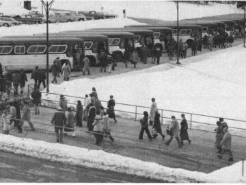 Evening bus lineup. The lineup of buses (1981) in the evening returning employees to the Pembroke area as well as Deep River. The Pembroke area buses, which had the greater distance to travel, left first and were parked at the starting end of the lineup.Photo source – AECL. 111-1000