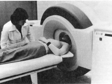 In July 1982 an AECL PET (positron emission tomography) unit was installed at the Montreal Neurological Institute. This unit was a combined CRNL-Commercial Products effort. The positron-emitting radioisotopes were generated on site using a Mini Cyclotron acquired by the Institute from Japan Steel Works.
<br /><br />
Photo and caption information – CRNL Chalk Talk, December 1982. 113-1000