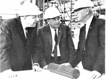 J.S. Foster discusses design of a uranium fuel bundle for Douglas Point G.S. with members of a New Zealand-Australia delegation.
<br /><br />
Photo and caption source – AECL Review, May 1967. 114-1000