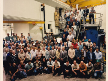 A 1985 photo in the cyclotron vault of the many CRNL employees who contributed to the completion of the TASCC facility. Photo source – AECL. 114-1000