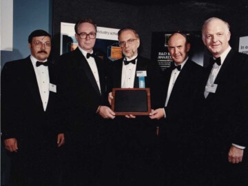 R&D 100 Award. In September of 1990 IMPELA was recognized as “One of the 100 Most-Significant New Products of the Year” by the USA-based, Research & Development, (R&D) Magazine. The award was presented to Dr. Terry Rummery, President of AECL Research, at a ceremony in Chicago on 26 September. L-R. J. Ungrin, T. Rummery, R. Jones (Chairman of R&D100) J. McKeown (Physics Manager, Accelerator Business Unit) and A. Stirling (General Manager, Accelerator Business Unit.) 120-1000