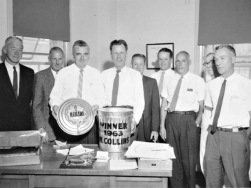 (L-R); Rupe Wright, Gib James, Harry Collins, Borden McCallum (Fire Protection Officer), Jimmy Davidson, Doug Breckon, John Holland, Jimmy Hickey, Jim Graham<br/>(The award was accompanied by a certificate with the citation “Awarded yearly to the man showing the greatest interest in the Golden Garbage Pail Campaign”). Harry Collins as Winner of 1963 Golden Garbage Pail Award